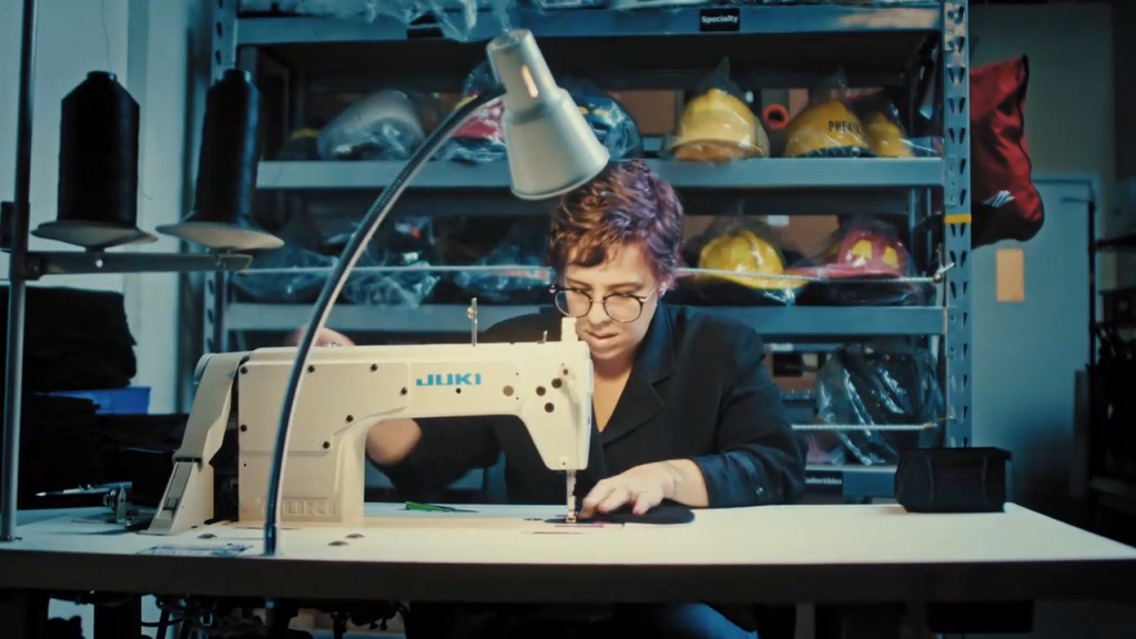 Employee sewing a product