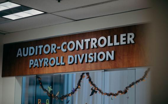 Sign that reads "Auditor-Controller Payroll Division"
