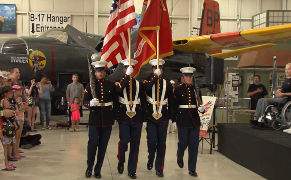 Four veterans holding flags