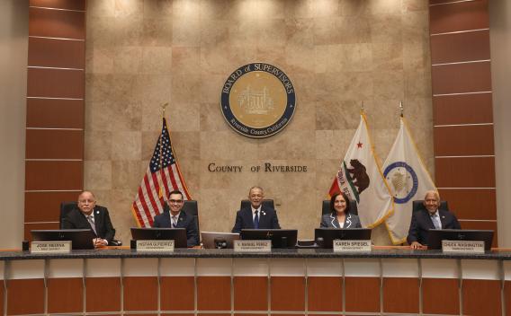 All five supervisors sitting at the dais